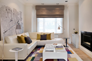 Inspiration for a medium sized contemporary formal open plan living room in London with white walls, laminate floors, no tv, a ribbon fireplace and brown floors.