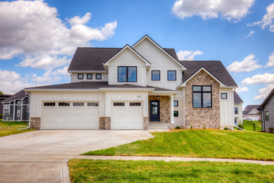 Country white house exterior idea in Other with a shingle roof