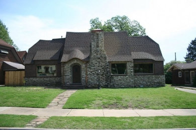 Inspiration for a large gray one-story stone exterior home remodel in Other