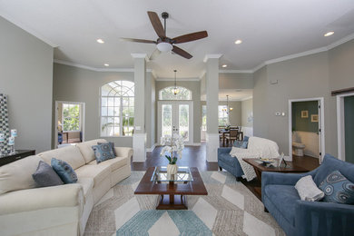 Living room - huge transitional open concept dark wood floor living room idea in Tampa with gray walls, no fireplace and no tv