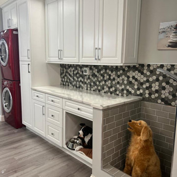 Laundry Room design with extra dryer and maximized storage space