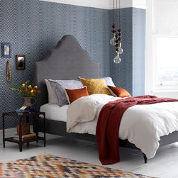 A traditional bed with earthy tones and textures - ベッドルーム用品