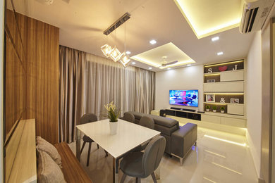 Contemporary dining room in Singapore with beige walls and porcelain floors.