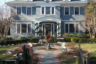 Large traditional blue two-story concrete fiberboard gable roof idea in New York