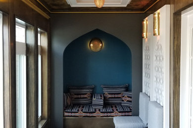 Example of a tuscan sunroom design in Boston