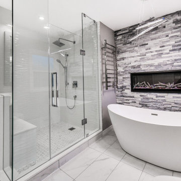 Striking Master Ensuite Featuring a Built-In Electric Fireplace