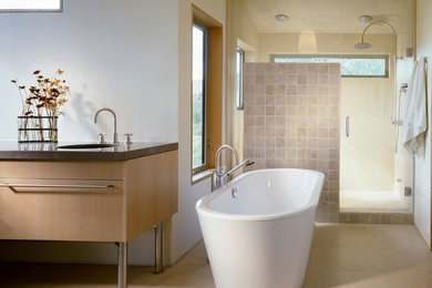 Inspiration for a large modern master gray tile and ceramic tile ceramic tile and beige floor bathroom remodel in Denver with flat-panel cabinets, light wood cabinets, white walls, an undermount sink, soapstone countertops and a hinged shower door