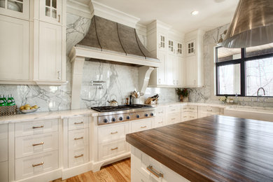 Example of a transitional kitchen design in Calgary