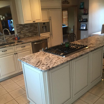cabinet refacing--antique white with new granite and backsplash
