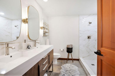 Inspiration for a mid-sized contemporary master white tile and porcelain tile slate floor, brown floor and double-sink bathroom remodel in Other with furniture-like cabinets, brown cabinets, a two-piece toilet, white walls, an undermount sink, quartzite countertops, a hinged shower door, white countertops, a niche and a freestanding vanity
