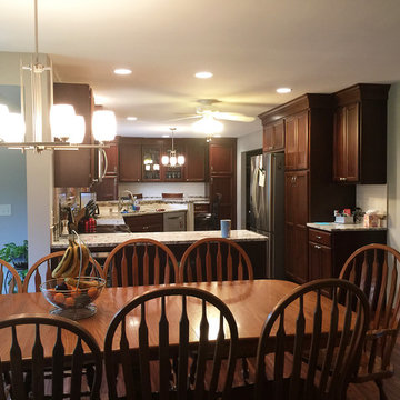 Ginger Snap Maple Cabinets in Updated Kitchen with Peninsula Seating