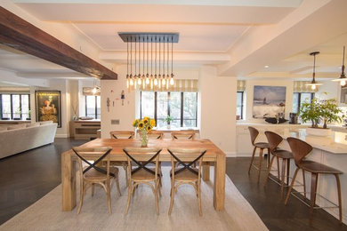 Inspiration for a mid-sized contemporary kitchen/dining combo in New York with beige walls and dark hardwood floors.