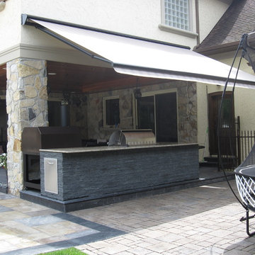 Retractable awning over outdoor kitchen
