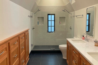 Bathroom - scandinavian white tile and ceramic tile ceramic tile, blue floor and single-sink bathroom idea in Portland with shaker cabinets, medium tone wood cabinets, a two-piece toilet, white walls, an undermount sink, quartz countertops, white countertops and a freestanding vanity