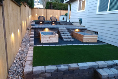 Inspiration for a mid-sized modern side yard concrete paver patio container garden remodel in Portland with no cover