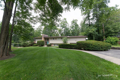 Photo of a midcentury home design in Indianapolis.