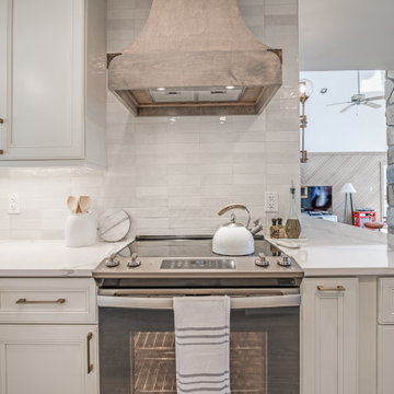 Neutral Kitchen with Wood Range Hood