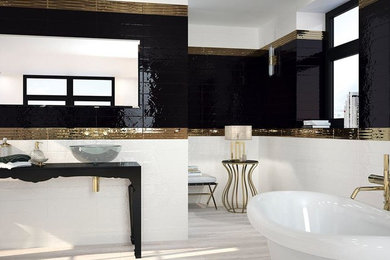 Mid-sized minimalist master black and white tile and ceramic tile light wood floor and beige floor claw-foot bathtub photo in Austin with open cabinets, black cabinets, black walls, a vessel sink and solid surface countertops