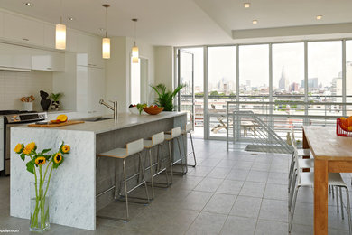 Example of a trendy kitchen design in New York with an island