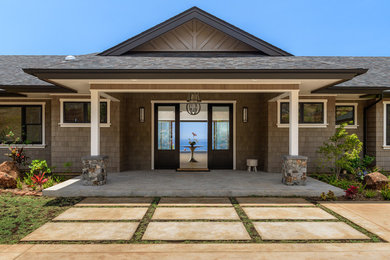 Inspiration for a large tropical one-story wood exterior home remodel in Hawaii