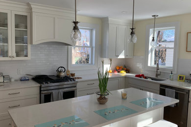 This is an example of a mid-sized kitchen in Boston.