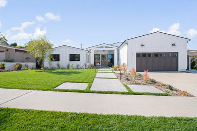 Large farmhouse white one-story exterior home photo in Orange County with a shingle roof
