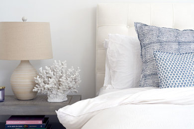 Inspiration for a beach style bedroom in New York with white walls.