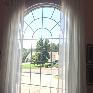 Pinch Pleat Sheer Drapery Panels on decorative traverse rod