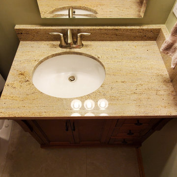 Finished basement bathroom with custom offset vanity top