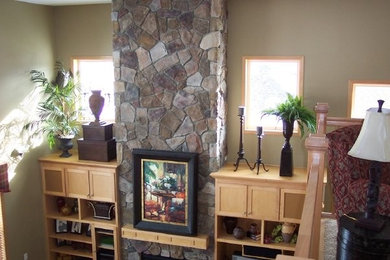 Inspiration for a mid-sized open concept living room remodel in Minneapolis with beige walls, a standard fireplace, a stone fireplace and no tv