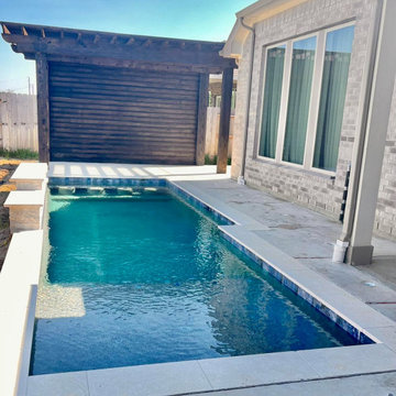 Lap Pool with Sun Ledge Alongside the Covered Patio