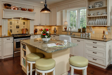 Small country u-shaped dark wood floor eat-in kitchen photo in Other with a farmhouse sink, recessed-panel cabinets, white cabinets, granite countertops, beige backsplash, ceramic backsplash, stainless steel appliances and an island
