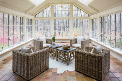 Sunroom - large contemporary terra-cotta tile sunroom idea in Miami with a skylight