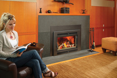 Living room - large transitional carpeted and brown floor living room idea in Seattle with brown walls, a standard fireplace and a stone fireplace