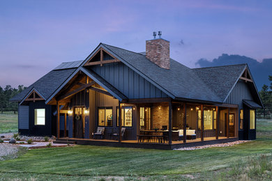 Example of a farmhouse exterior home design in Denver