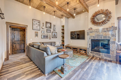 Example of a mountain style living room design in Denver