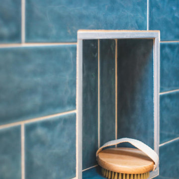 Oasis Tiny Home Blue Tile Shower Built-in Shelf