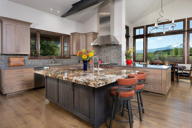 Inspiration for a large contemporary l-shaped light wood floor and brown floor eat-in kitchen remodel in Denver with an undermount sink, recessed-panel cabinets, medium tone wood cabinets, granite countertops, multicolored backsplash, matchstick tile backsplash, stainless steel appliances, an island and brown countertops