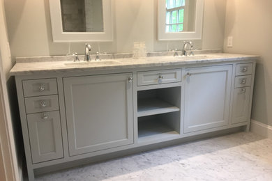 Inspiration for a large timeless double-sink bathroom remodel in Manchester with recessed-panel cabinets, gray cabinets and a built-in vanity