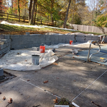 STONE FIREPLACE  , BBQ GRILL   AND STONE RETAINING WALL