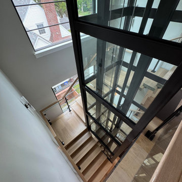 Project #136 | Modern Floating Staircase Encircling Glass Elevator