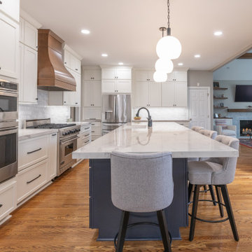 Porcelain Island Kitchen Remodel with Custom Built-Ins + Fireplace Feature