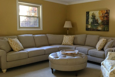 Family room - mid-sized traditional open concept carpeted and beige floor family room idea in Indianapolis with a standard fireplace, a brick fireplace and a corner tv