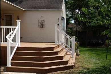 Inspiration for a mid-sized timeless backyard deck remodel in Chicago with a roof extension