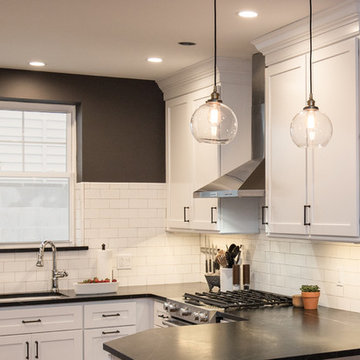 Urban Loft Kitchen Remodel | White Shaker Cabinetry & Exposed Brick
