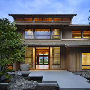 ワシントンD.C.の両開きドアアジアンスタイルのおしゃれな玄関ドア (コンクリートの床) の写真