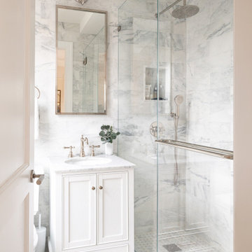 Secondary Bathroom with Frameless Shower and Polished Nickel Fixtures