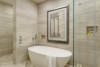 Freestanding bathtub - small modern master beige tile and limestone tile limestone floor and beige floor freestanding bathtub idea in New York with beige walls