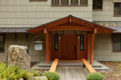 Contemporary green two-story wood exterior home idea in Burlington