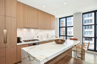 Inspiration for a mid-sized modern single-wall open concept kitchen remodel in New York with an undermount sink, flat-panel cabinets, medium tone wood cabinets, white backsplash, stainless steel appliances, an island and white countertops